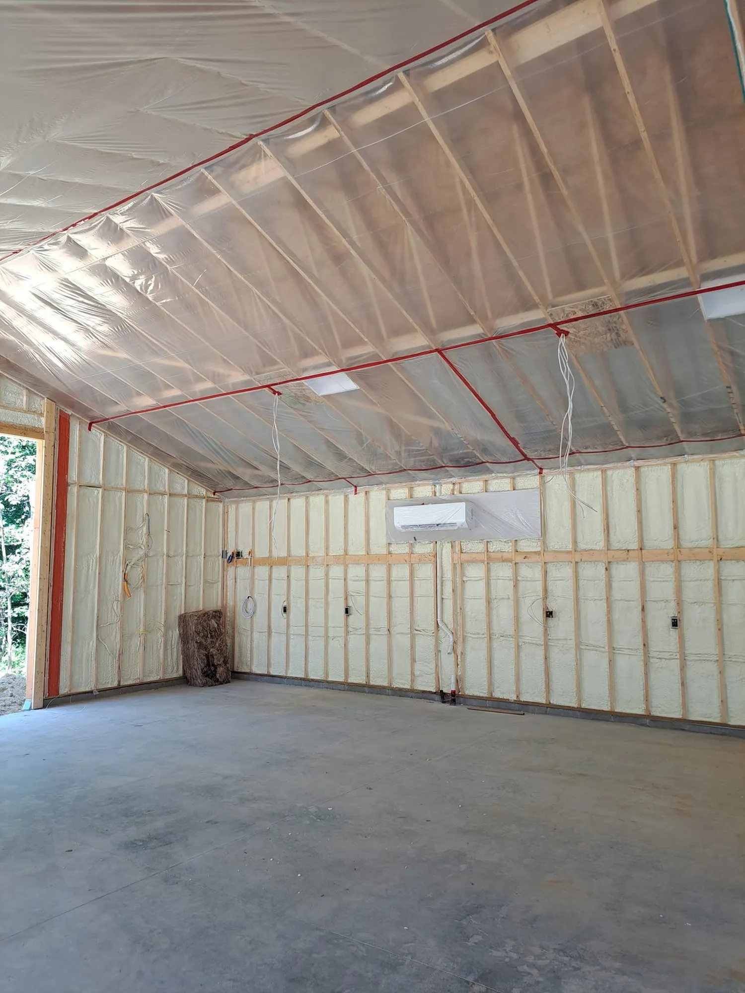 Fresh spray foam between framing members