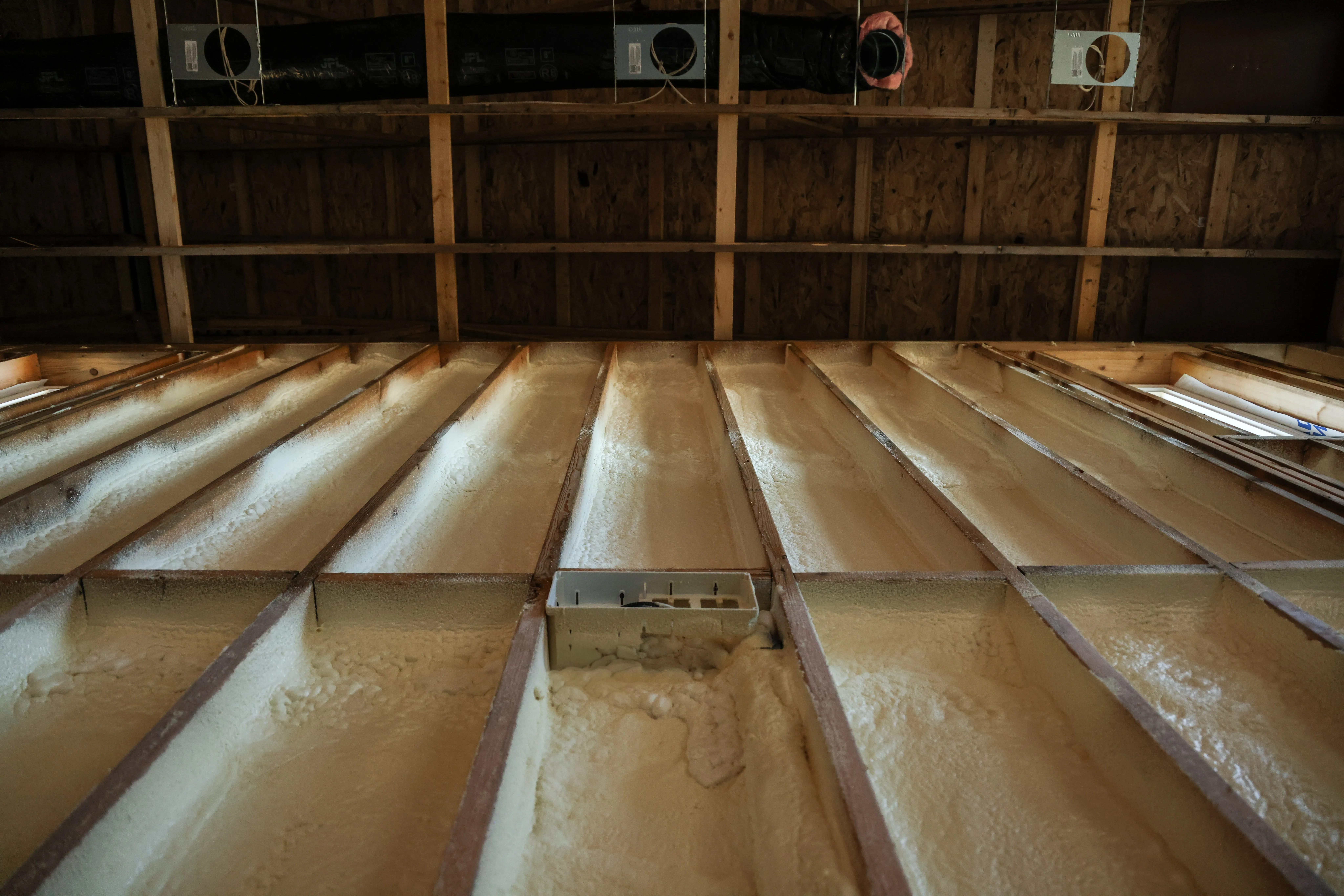 Professional spray foam insulation work in a framed structure